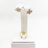 Juego de aretes y anillo con diseño de flor en oro amarillo de 18kt. con diamantes